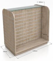 Rustic oak slatwall display stand with a glass top shelf and dimension labels showing 1240mm width, 700mm depth, 300mm top overhang, and 300mm side overhang on a white background.
