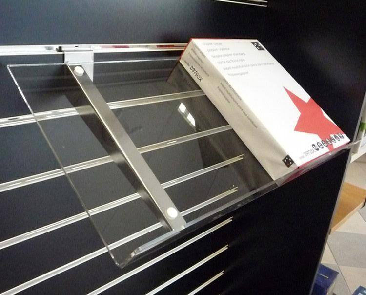 Sloping Acrylic shelves on metal brackets
